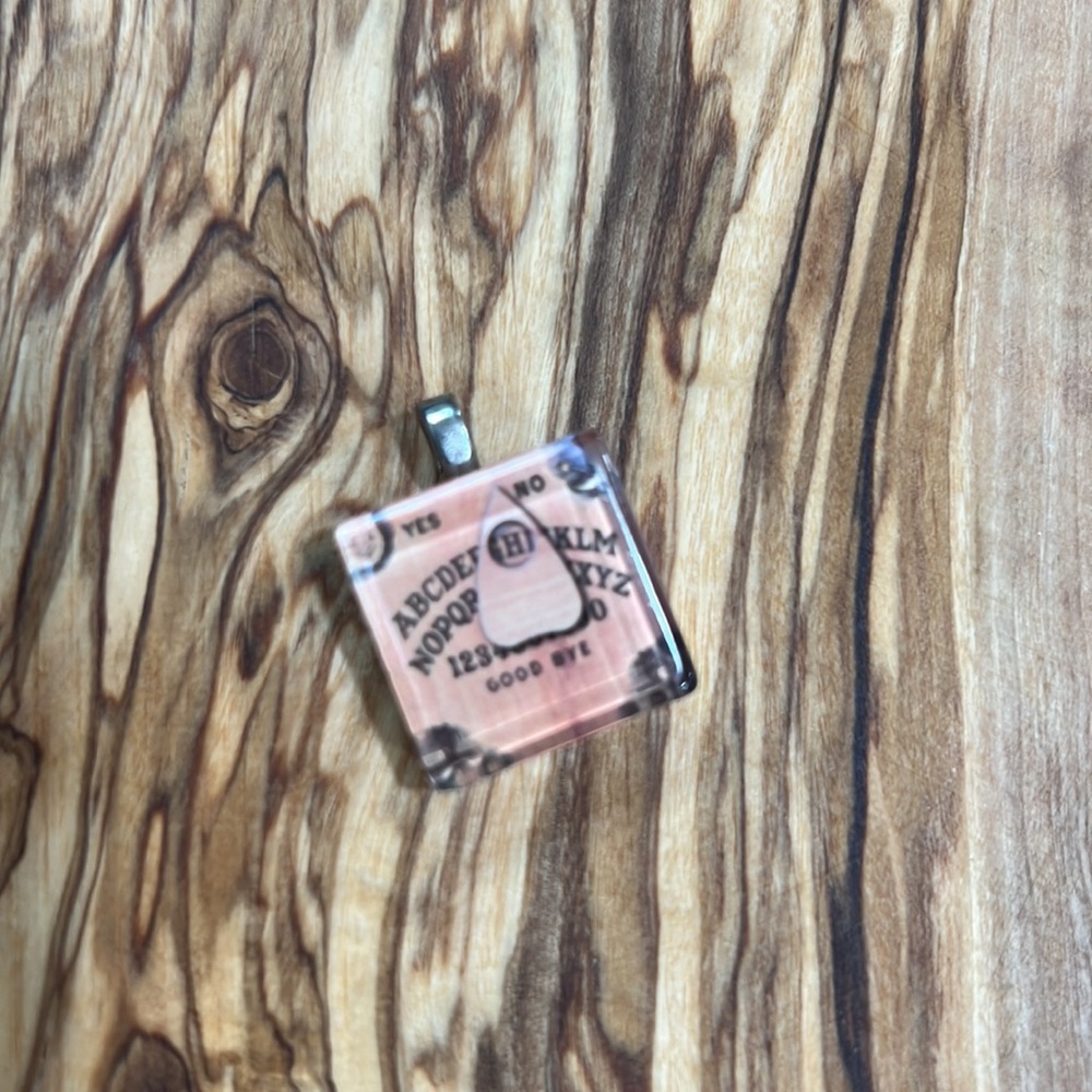 Scrabble tile oh Ouija board pendant. No scratches perfect condition.